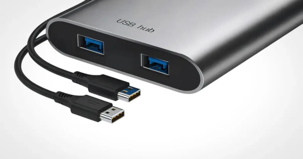 USBハブとケーブルトレーを組み合わせて配線を整理したデスクの写真